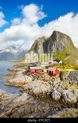 Red wooden fishermen`s huts rorbu, Lofoten Island landscape, Norway Stock Photo